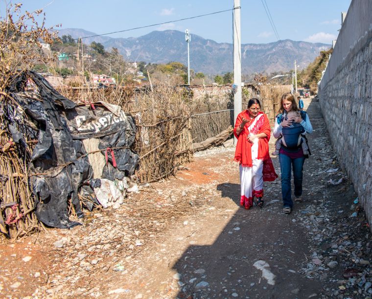 Renu and Judith on their way to a slum